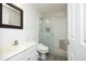 Modern bathroom features a glass shower enclosure, sleek fixtures, and elegant tile work at 5403 Bayside Ct, Raleigh, NC 27613