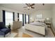 Staged bedroom with natural light, calming blue accents, and warm neutral tones for a serene feel at 5403 Bayside Ct, Raleigh, NC 27613