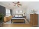 Virtually staged bedroom featuring a modern bed, dresser, and decor at 5403 Bayside Ct, Raleigh, NC 27613