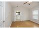 Empty bedroom with a doorway leading to an en-suite bathroom and natural light at 5403 Bayside Ct, Raleigh, NC 27613