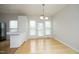 Bright breakfast nook with hardwood floors and a view of the kitchen area, perfect for casual dining at 5403 Bayside Ct, Raleigh, NC 27613