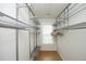 Spacious walk-in closet with custom shelving and a window for natural light at 5403 Bayside Ct, Raleigh, NC 27613