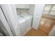 Convenient laundry room equipped with washer and dryer, and a door offering backyard access at 5403 Bayside Ct, Raleigh, NC 27613