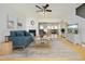 Cozy living room features a fireplace, comfortable seating, and open access to the dining area at 5403 Bayside Ct, Raleigh, NC 27613