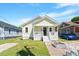 Inviting curb appeal with a well-maintained lawn and cozy porch at 545 E Lenoir St, Raleigh, NC 27601