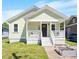 Charming home featuring a welcoming front porch and manicured lawn at 545 E Lenoir St, Raleigh, NC 27601