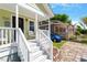 Welcoming front porch with white railings and a comfortable seating area at 545 E Lenoir St, Raleigh, NC 27601