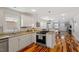 Updated kitchen features granite countertops, stainless steel appliances, and hardwood floors at 545 E Lenoir St, Raleigh, NC 27601
