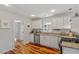 Efficient kitchen with white cabinetry, granite countertops, and stainless steel appliances at 545 E Lenoir St, Raleigh, NC 27601