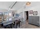 Modern living room with work space, industrial ceiling, and kitchen access at 545 E Lenoir St, Raleigh, NC 27601