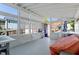 Sun-drenched patio with white furniture, offering a relaxing outdoor space and view of the backyard at 545 E Lenoir St, Raleigh, NC 27601