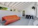 Enclosed porch with white walls, plenty of seating and an exterior door at 545 E Lenoir St, Raleigh, NC 27601
