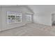 Large primary bedroom with carpet and windows providing ample natural light at 601 Benton Dr, Oxford, NC 27565