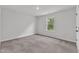 Bright bedroom with cozy carpet, natural light from the window and neutral color palette offers a calm retreat at 601 Benton Dr, Oxford, NC 27565