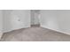 Bedroom featuring neutral carpet, double closet, and nearby doorway for easy accessibility and movement at 601 Benton Dr, Oxford, NC 27565