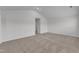 Expansive bedroom showcasing neutral carpeting, with an adjacent walk-in closet for organized storage solutions at 601 Benton Dr, Oxford, NC 27565