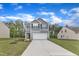 Beautiful two-story home boasts an attached two-car garage, long driveway and well-kept lawn at 601 Benton Dr, Oxford, NC 27565
