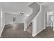 Inviting foyer with hardwood floors, a staircase, and an open view to the living area at 601 Benton Dr, Oxford, NC 27565