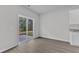 Dining area with sliding glass doors leading to patio and partial view of modern kitchen at 601 Benton Dr, Oxford, NC 27565