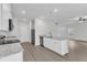 Open kitchen with white cabinets, granite countertops, stainless steel appliances, and an island at 601 Benton Dr, Oxford, NC 27565