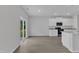 Kitchen and dining area with sliding glass doors and modern white cabinets at 601 Benton Dr, Oxford, NC 27565