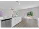 Spacious kitchen island with granite countertops, stainless steel appliances, and sliding glass door to outdoors at 601 Benton Dr, Oxford, NC 27565