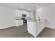 Modern kitchen with white cabinets, stainless steel appliances, and an island with granite countertop at 601 Benton Dr, Oxford, NC 27565