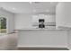 Open kitchen view featuring granite countertops, white cabinets, stainless steel appliances, and a sink at 601 Benton Dr, Oxford, NC 27565