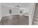 Spacious living room featuring hardwood floors, a modern ceiling fan, and bright natural light at 601 Benton Dr, Oxford, NC 27565