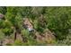 An aerial view of the backyard and firepit surrounded by lush greenery at 6105 Splitrock Trl, Apex, NC 27539
