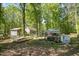 Lush backyard featuring multiple garden structures perfect for outdoor living at 6105 Splitrock Trl, Apex, NC 27539