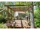 Outdoor deck with wooden pergola is great for entertaining at 6105 Splitrock Trl, Apex, NC 27539