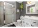 Updated bathroom featuring a glass shower enclosure, white vanity, and sleek fixtures at 6105 Splitrock Trl, Apex, NC 27539