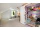 This bonus room features ample storage and a separate closet for toys and games at 6105 Splitrock Trl, Apex, NC 27539
