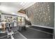 This modern gym features rubber flooring, a climbing wall, and space for exercise equipment at 6105 Splitrock Trl, Apex, NC 27539