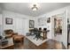 Bright home office featuring hardwood floors, a workstation, and natural light at 6105 Splitrock Trl, Apex, NC 27539
