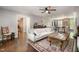 Spacious living room featuring hardwood floors, a comfortable sofa, and an open floor plan at 6105 Splitrock Trl, Apex, NC 27539