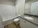 Bathroom with granite countertops, a vanity, a mirror, and a shower-tub combo at 70 Pate Landing Dr, Selma, NC 27576