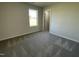 Bedroom with a window and a view, carpeted floors, and access to a closet at 70 Pate Landing Dr, Selma, NC 27576
