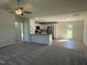 Open-concept living room and kitchen boasts natural light, modern fixtures and finishes at 70 Pate Landing Dr, Selma, NC 27576