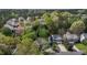 An aerial view of a charming suburban neighborhood with mature trees and attractive single-Gathering homes at 703 Midsummer Ln, Apex, NC 27502