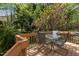 Cozy outdoor deck featuring a metal table and chairs perfect for relaxing and enjoying the scenery at 703 Midsummer Ln, Apex, NC 27502