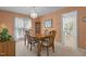 Formal dining room featuring a wooden table, chairs, and a decorative chandelier at 703 Midsummer Ln, Apex, NC 27502