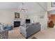 Cozy living room featuring a fireplace, high ceilings, and comfortable seating arrangements at 703 Midsummer Ln, Apex, NC 27502
