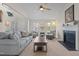 Comfortable living room with a fireplace, vaulted ceilings, and ample natural light at 703 Midsummer Ln, Apex, NC 27502