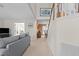 Spacious living room with high ceilings connects to a dining room and stairway at 703 Midsummer Ln, Apex, NC 27502