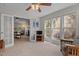 Bright sunroom with multiple windows offering garden views at 703 Midsummer Ln, Apex, NC 27502
