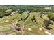 Expansive aerial view of a golf course, residential area, and ponds at 720 Raymond Dr, Clayton, NC 27527