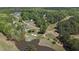 Aerial view of neighborhood near a golf course with pond and green at 720 Raymond Dr, Clayton, NC 27527