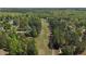 Aerial view showcasing the backyard, golf course, and mature tree coverage at 720 Raymond Dr, Clayton, NC 27527